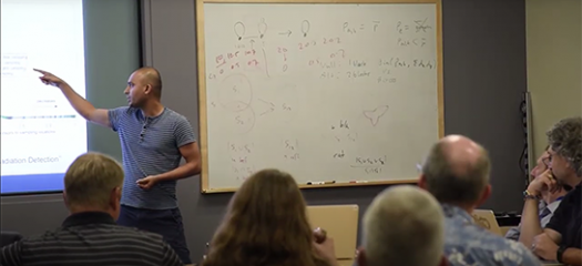 a computer scientist presents to a room full of people