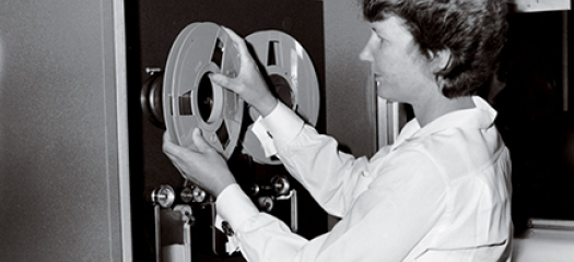Edna Vienop loads a tape on the IBM 704