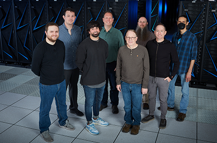 the Systems Software and Security group standing in front of the Sierra supercomputer