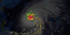 simulation of a hurricane in bright colors on a dark background