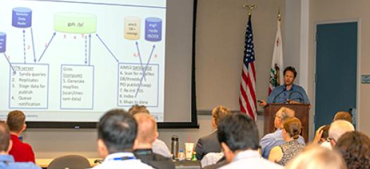 Sasha at a podium presenting ESGF work