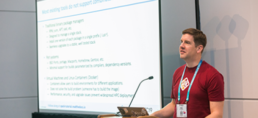 Todd at a podium delivering a talk at SC19