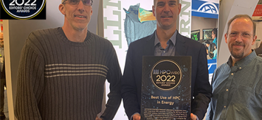 Timo, Brian, and Brian standing with the award