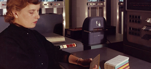 Unidentified employee (Ruth Kilby, possible) with IBM 704, November 1957