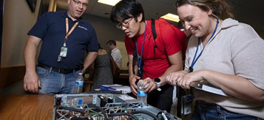 Developer Day attendees are looking down into a Sierra supercomputer cluster node.