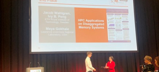 Jacob Wahlgren is on stage accepting the Research Poster Award certificate