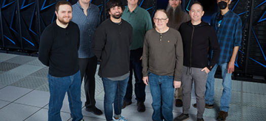 the Systems Software and Security group standing in front of the Sierra supercomputer