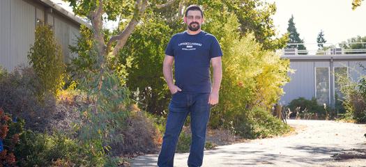 Rodrigues stands outside a building at LLNL