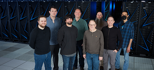the Systems Software and Security group standing in front of the Sierra supercomputer