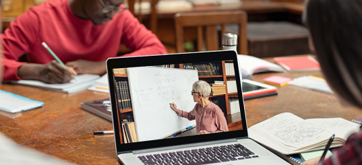 stock photo of people studying and learning at a laptop