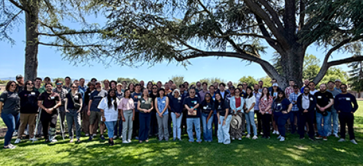 large group of CASC members posed in a city park