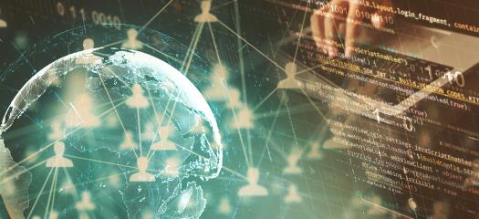 stock image of the Earth overlaid with lines of code and person's hands on a keyboard