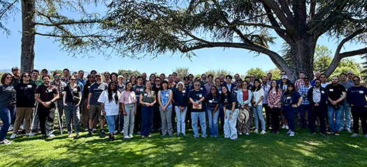 large group of CASC members posed in a city park