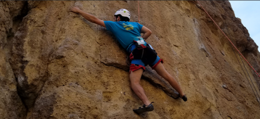 Greg Becker rock climbing