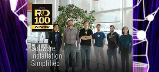 Spack team in B453 lobby with R&D 100 logo
