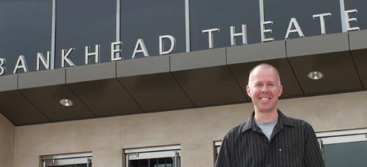 Kirk Sylvester stands outside the Bankhead Theater