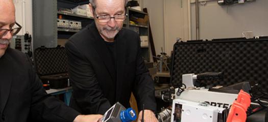 Greg White and Steven Kreek inspect the Radiation Field Training Simulator