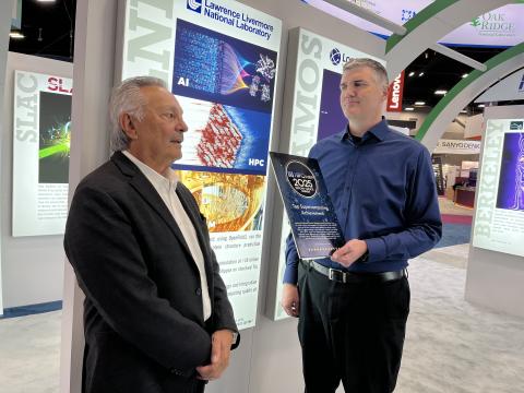 Adam Bertsch holds an award from HPCwire