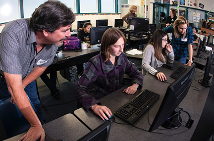Students learn at computer terminals