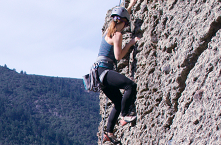 Rachael climbing a rock face