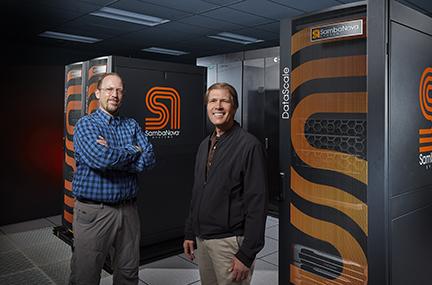 Brian Van Essen and Bronis de Supinski in front of SambaNova systems
