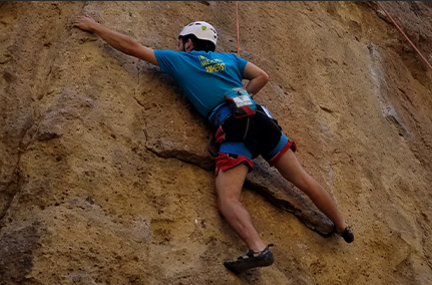Greg Becker rock climbing
