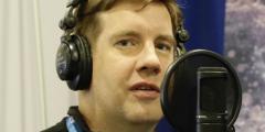 Todd with headphones and a microphone