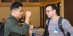 Two DSSI interns confer during one of the workshop’s networking breaks.