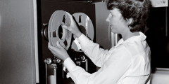Edna Vienop loads a tape on the IBM 704