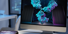 antibody and supercomputer on a laptop screen with the Nature cover image on the desktop