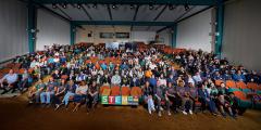 large group of people assembled in an auditorium