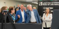 DOE secretary and LLNL officials in the machine room