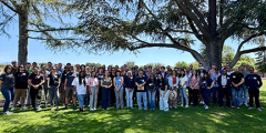 large group of CASC members posed in a city park