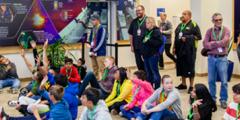 Inside NIF’s lobby, STEM Day docent and graphics designer John Jett discusses the role of art in science and technology communications