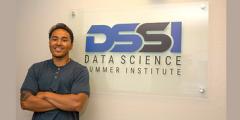 Alan in front of the DSSI wall sign