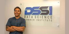 Alan in front of the DSSI wall sign