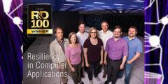 SCR team in front of Sierra with R&D 100 logo
