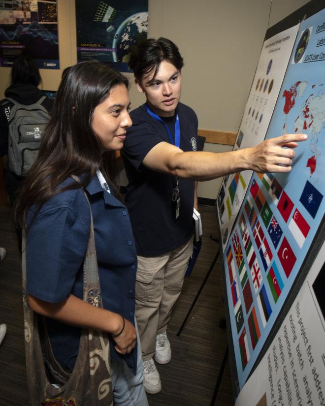 A Dev Day attendee learns about the Joint Conflict and Tactical Simulation (JCATS) project, one of the exhibitors at the Tech Expo. 