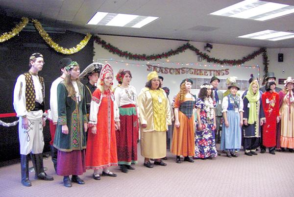 Legacy photo of CASC holiday party with costumed singers